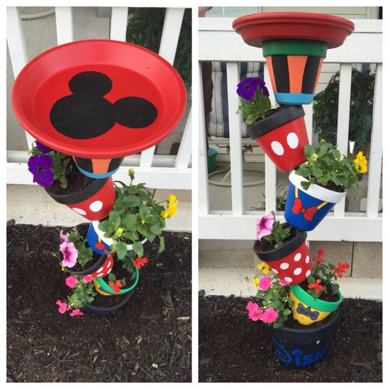 Disney planter/birdbath! Used patio paint and secured it with 1/2 in rebar! Amazing colors for spring!: 